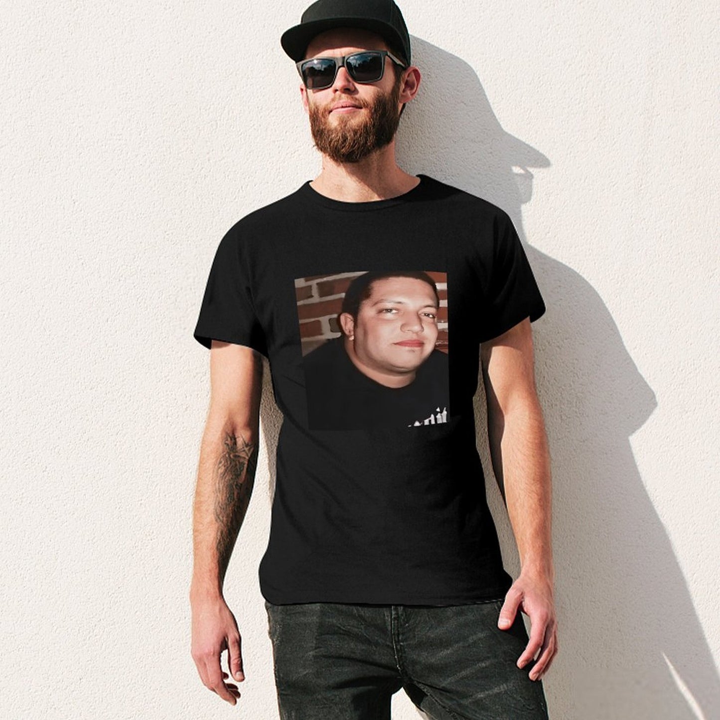 Inkmay Casual Cotton T-shirt Man Wears Black Shirt Against Brick Unisex T-shirtFresh On-Demand T-Shirt